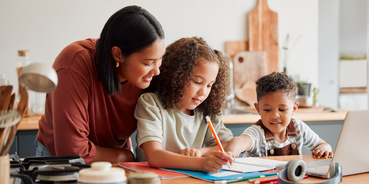 A parent sitting with their child at a desk, guiding them through homework tasks in a quiet and organized environment. This illustrates the importance of parental support in creating a productive homework routine.