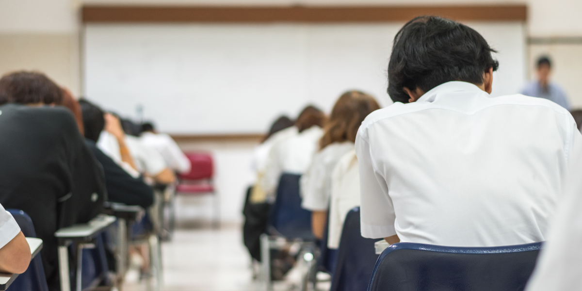 A full high school classroom with students engaged in their studies, illustrating how back-to-school anxiety eases as students adjust to their new routines.