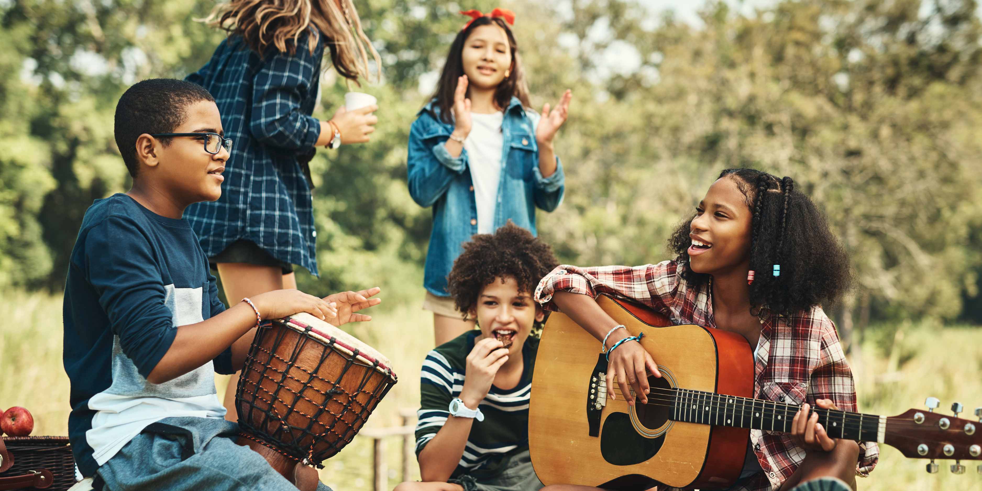 Kids playing musical instruments together, fostering creativity and teamwork while exploring their love for music as a potential passion or career.