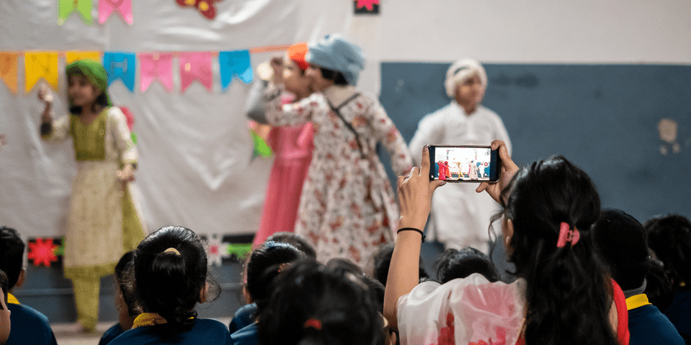 A group of children performing in a reader’s theatre, showcasing how interactive reading activities make literacy fun and engaging.