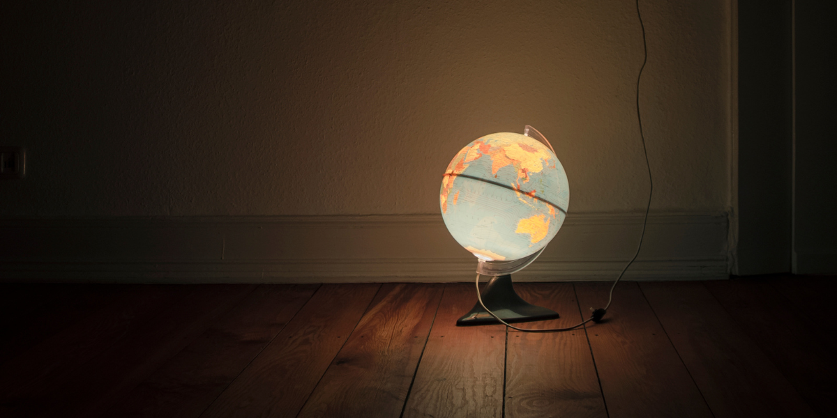 A creative globe light fixture adds a unique touch to a study space, providing both illumination and a subtle geography reference for students.