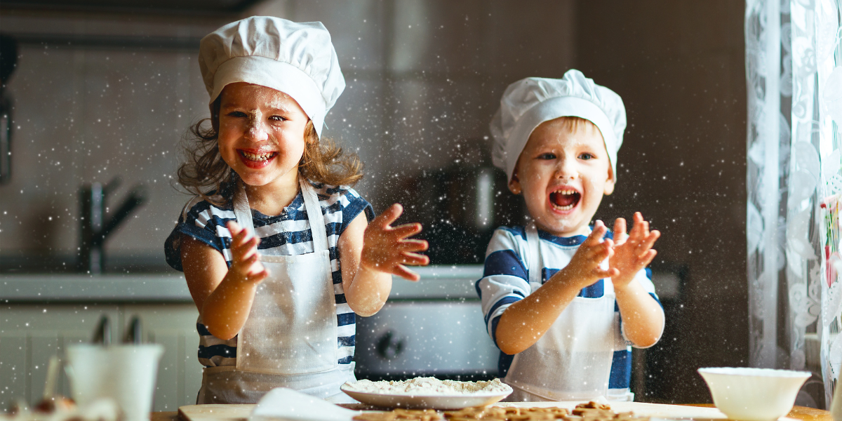 A group of kids having fun in the kitchen, gaining hands-on experience in cooking and teamwork—one of the many benefits of home economics that teaches essential life skills.